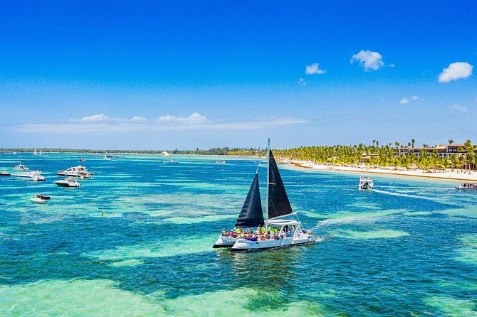 Catamaran Cruise with Snorkeling & Parasailing - Music, open bar, fruit, and snacks on board