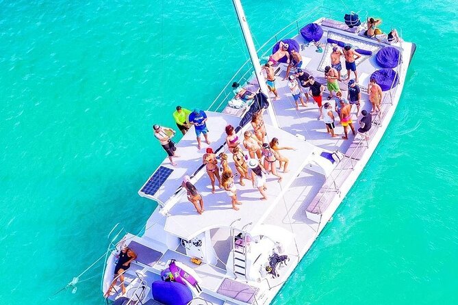 Catamaran Cruise with Snorkeling & Parasailing - Boarding the catamaran at Los Corales beach