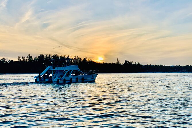 Private Catamaran Cruise with Slide & unlimited drinks - A beach stop for swimming and photos