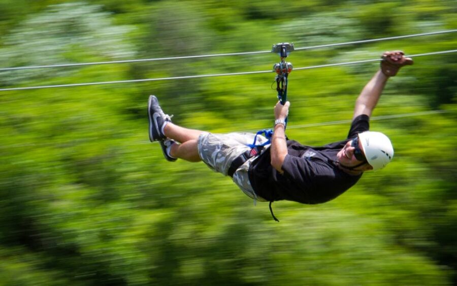 Punta Cana: Blue Hole and Scape Park Cap Cana Entry Ticket - Flying through the trees on the zip lines