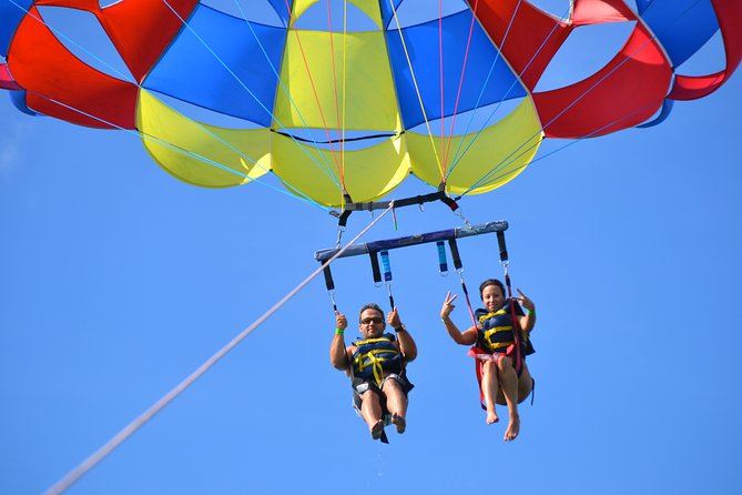 Punta Cana Party Cruise with Snorkeling, Hooka Diving and Parasailing - Parasailing above the Caribbean