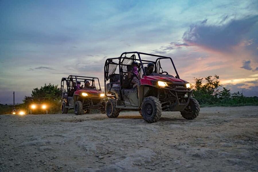 Punta Cana: Sunset Buggy Tour With Cave Swim and Dance Show - Entering the cenote after dark