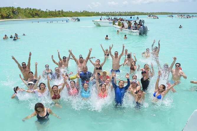 Saona Catamaran Cruise with Lunch and Natural Swimming Pool - Saona Island offers palms, lunch, and a crowded public-beach feel