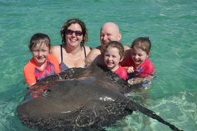 Small Group Snorkeling, Sharks & Stingrays Encounter by boat - Family fit, music, and group size